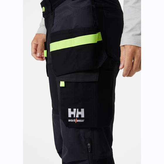 HELLY HANSEN 77405 OXFORD 4-WAY STRETCH CONSTRUCTION WORK PANT TROUSER BLACK / GREY - Premium KNEE PAD TROUSERS from Helly Hansen - Just £89.47! Shop now at Workwear Nation Ltd