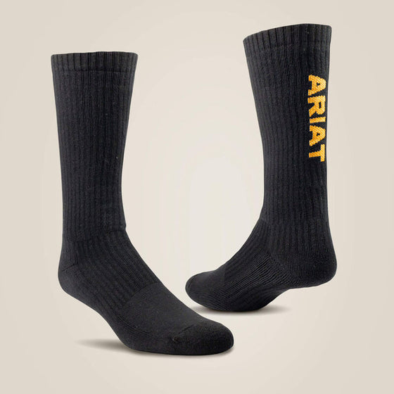 Black socks with 'Ariat' branding on a beige background